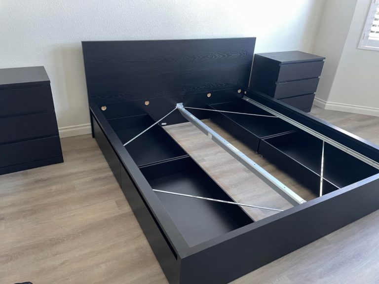 IKEA queen bed with drawers underneath as well as cabinets just assembled.