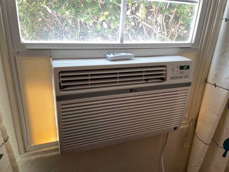 Window AC unit with a remote control installed in the window